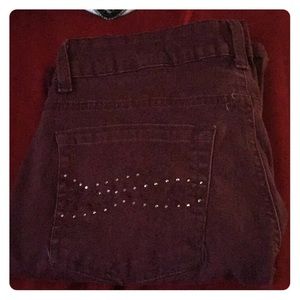 A pair of burgundy jeans size 12